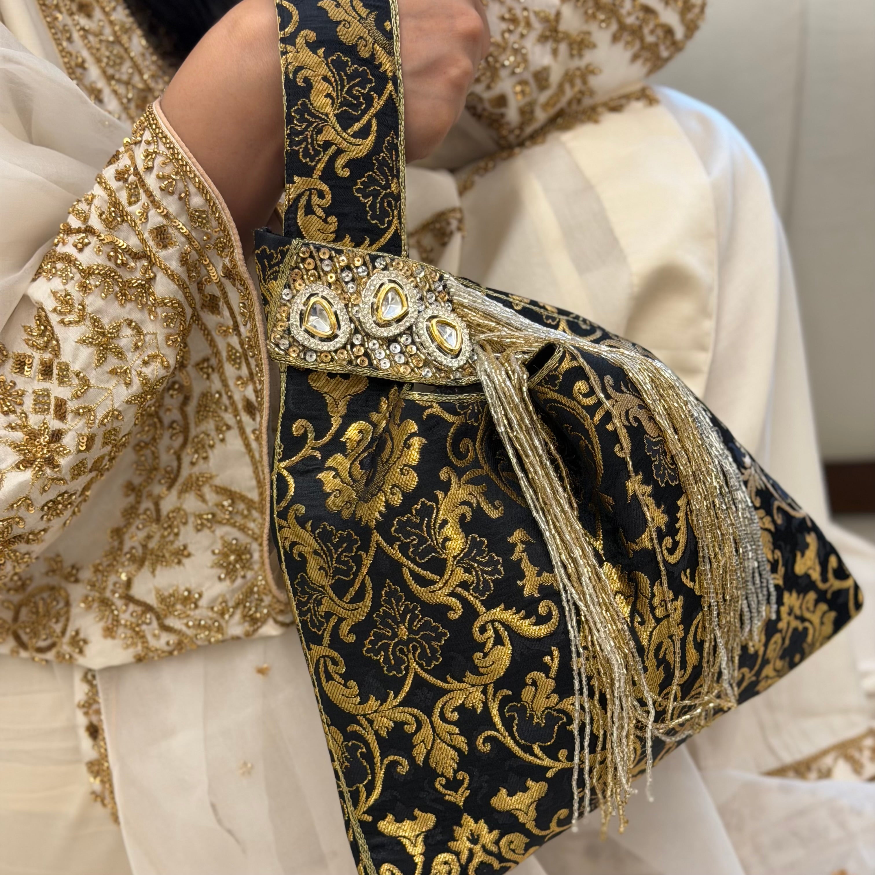 Triangular Brocade Potli Bag In Black With Tassels