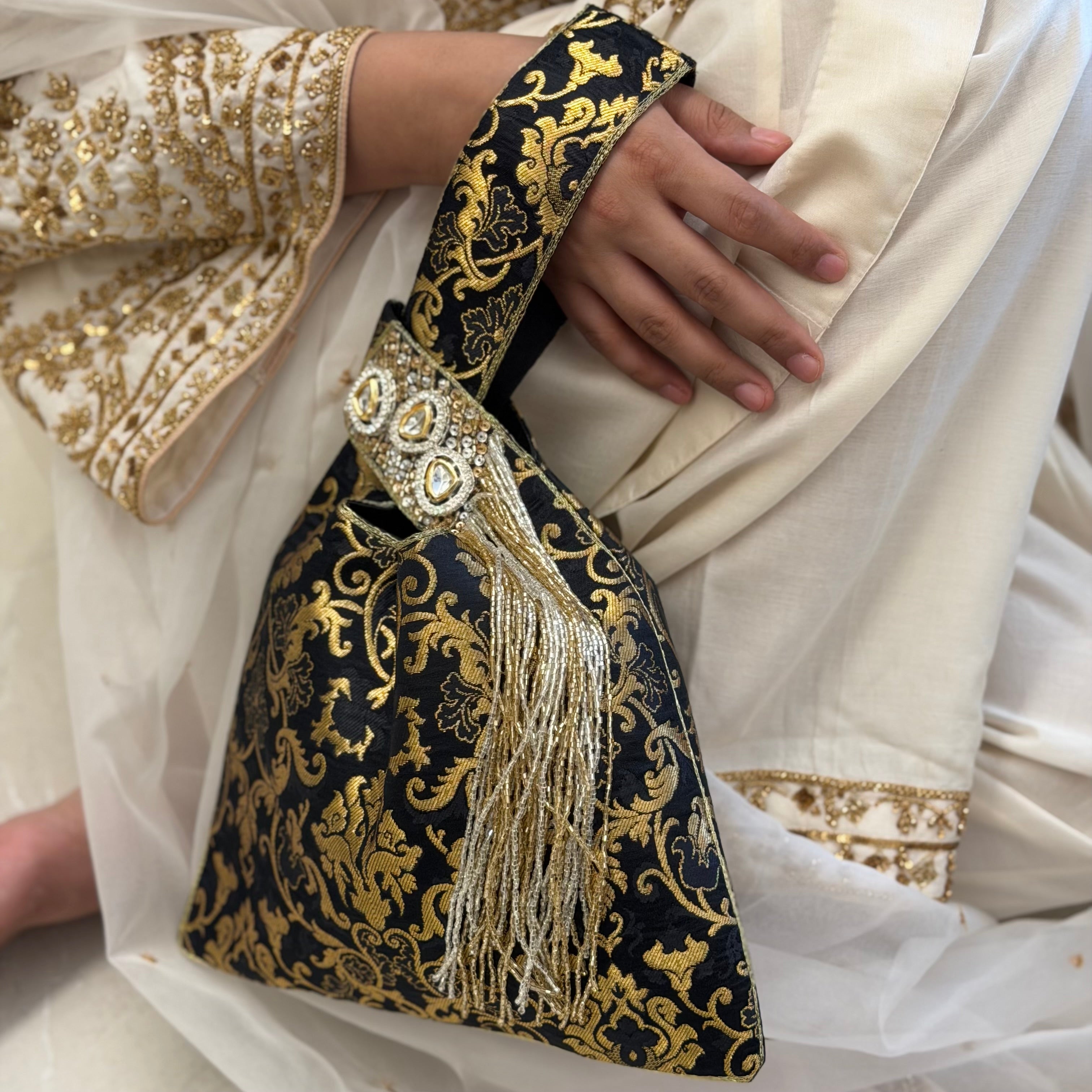 Triangular Brocade Potli Bag In Black With Tassels