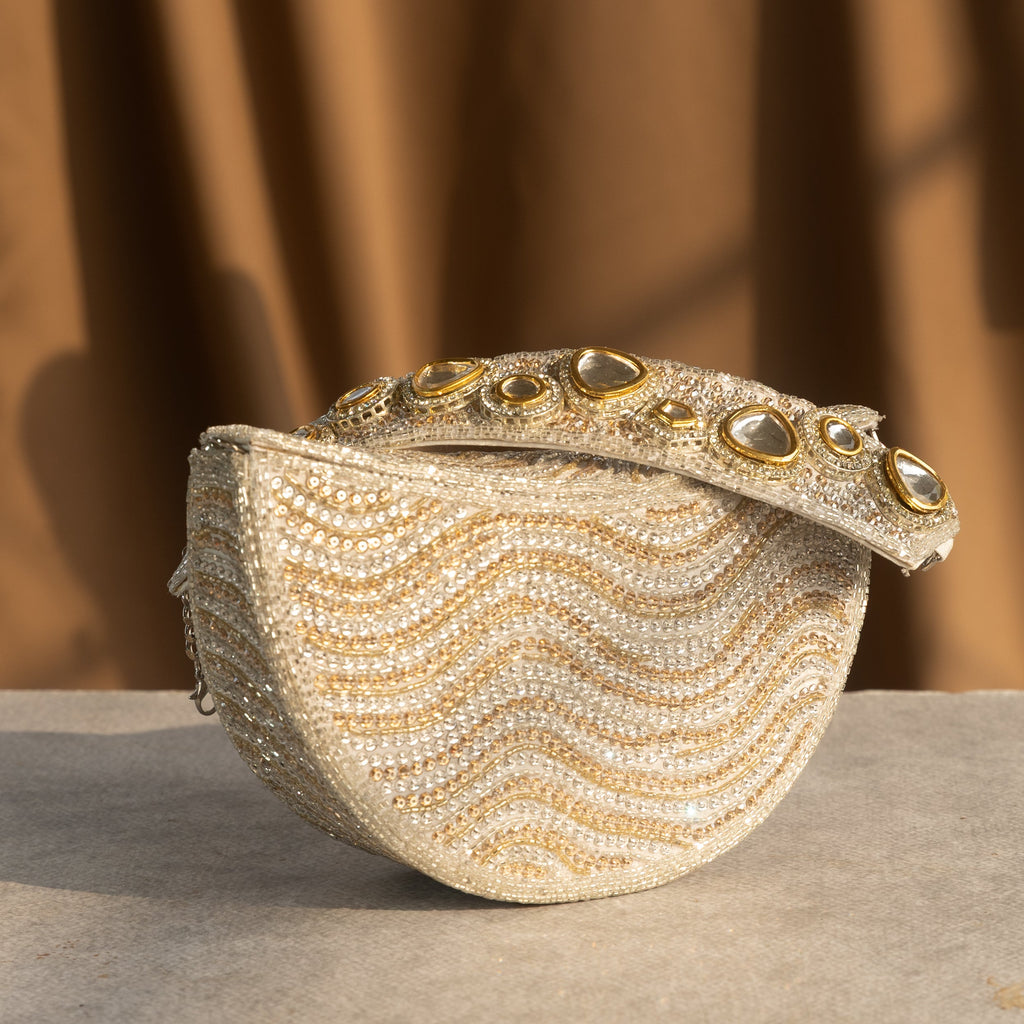Golden Wave Embellished Clutch With Polki Details Handle