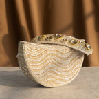 Golden Wave Embellished Clutch With Polki Details Handle