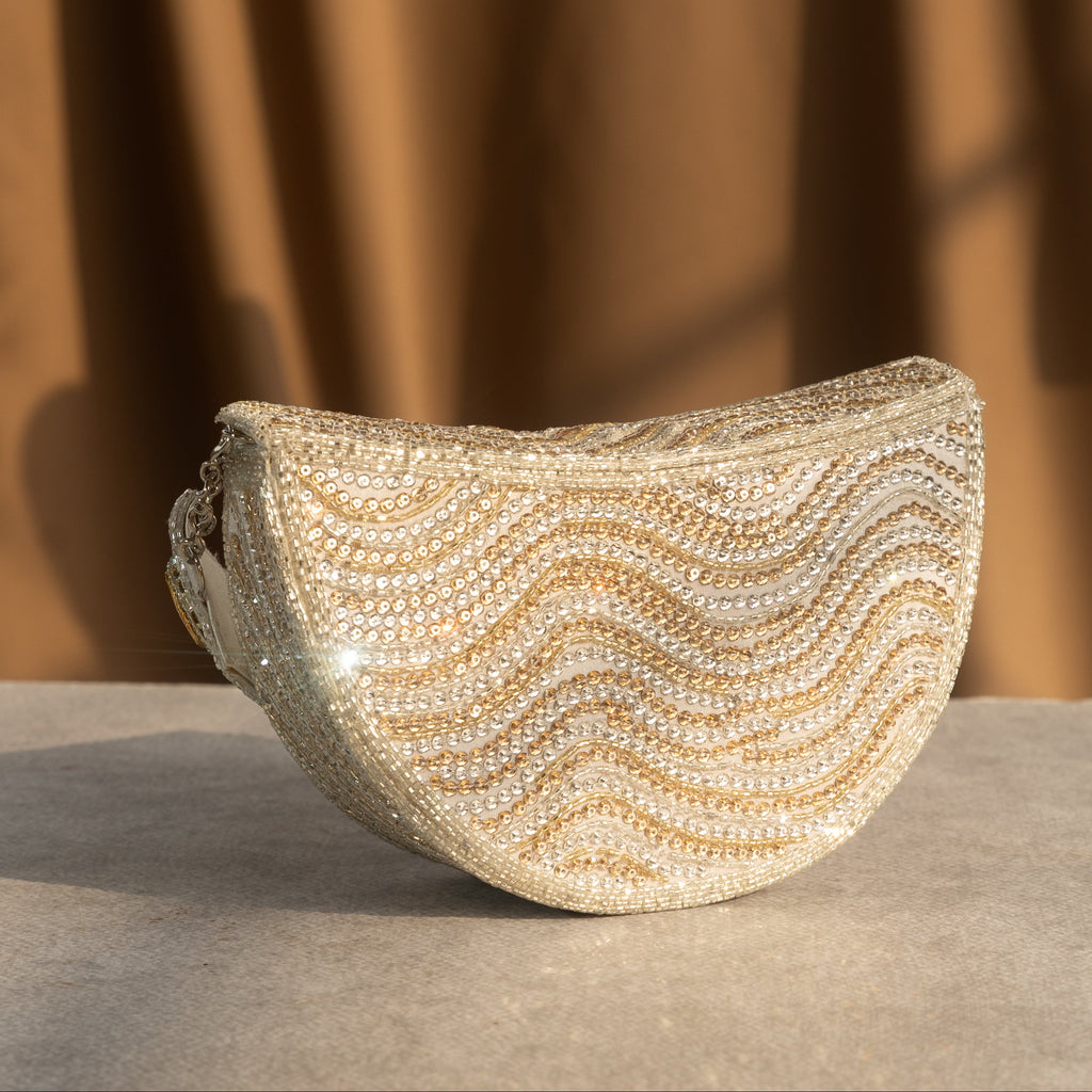 Golden Wave Embellished Clutch With Polki Details Handle