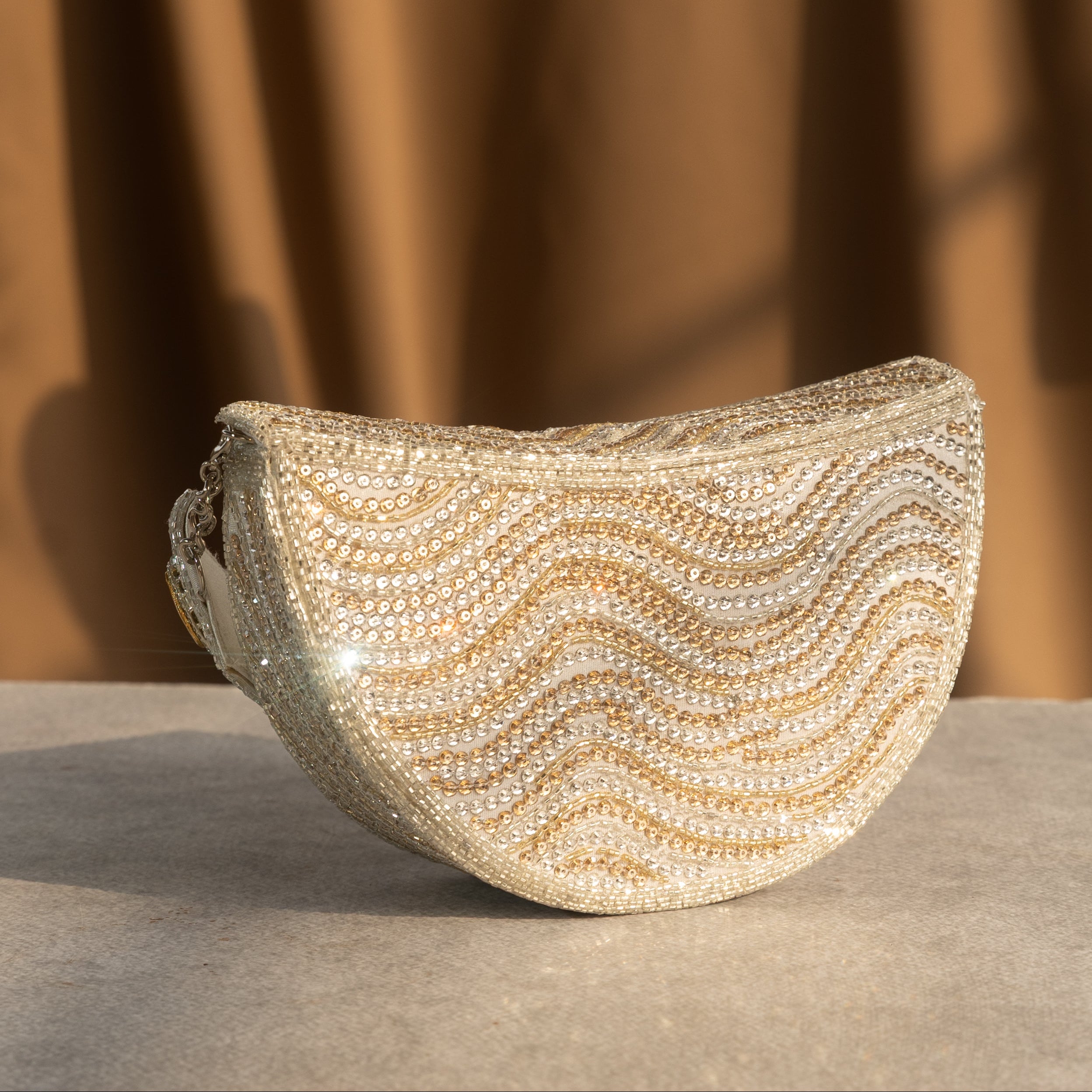 Golden Wave Embellished Clutch With Polki Details Handle