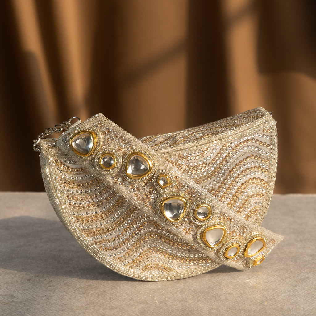 Golden Wave Embellished Clutch With Polki Details Handle