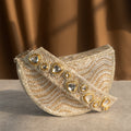 Golden Wave Embellished Clutch With Polki Details Handle